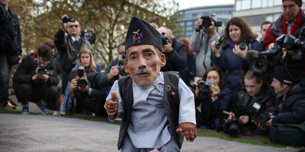 LONDON, ENGLAND - NOVEMBER 13: The shortest man ever, Chandra Bahadur Dangi meets the worlds tallest man, Sultan Kosen (not in shot) for the very first time on November 13, 2014 in London, England. Chandra from Nepal measuring 54.6 cm (21.5 inches) posed for photographers with Sultan from Turkey who is 251 cm (8 ft 3 inches). Today is the 10th annual Guinness World Records Day during which thousands of people are expected to come together to celebrate the international day of record-breaking! (Photo by Peter Macdiarmid/Getty Images)