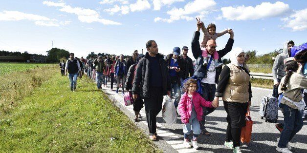 Migrants, mainly from Syria, walk on the highway 12km north of Rodby, Denmark moving to the north on September 7, 2015. The refugees want to reach Sweden to seek asylum there. AFP PHOTO / Scanpix Denmark /BAX LINDHARDT DENMARK OUT (Photo credit should read BAX LINDHARDT/AFP/Getty Images)