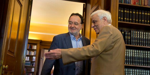 Former Energy Minister and head a party called Popular Unity , Panagiotis Lafazanis, left , is welcomed by Greek President Prokopis Pavlopoulos, in Athens, Monday Aug. 24, 2015. Lafazanis, who heads the newly-formed Popular Unity, received the maximum three-day mandate from the countryâs president after the head of the main opposition conservative New Democracy failed to form a government. (AP Photo/Petros Giannakouris)