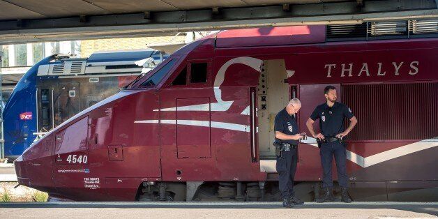 French police stand guard along the platform next to a Thalys train of French national railway operator SNCF at the main train station in Arras, northern France, on August 22, 2015, the day after an armed gunman on the train was overpowered by passengers. The gunman opened fire on the train travelling from Amsterdam to Paris, injuring two people before being tackled by several passengers including off-duty American servicemen. AFP PHOTO PHILIPPE HUGUEN (Photo credit should read PHILIPPE HUGUEN/AFP/Getty Images)