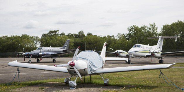 Light aircraft are pictured at Blackbushe Airport in Hampshire, southern England on August 1, 2015. Members of Osama Bin Laden's family were among the victims in the crash of a private jet in Britain, the Saudi embassy in London said Saturday in a message of condolences. Four people died when the Saudi Arabia-registered plane ploughed into a car auction site and burst into flames in southern England on Friday. AFP PHOTO / JACK TAYLOR (Photo credit should read JACK TAYLOR/AFP/Getty Images)