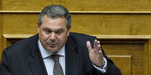 Greek defense minister Panos Kammenos delivers a speech during a joint session of four committees of the Parliament (Economic, Social, Public Administration and Production and Trade) at the Greek Parliament in Athens on July 10, 2015. Lawmakers in Greece are to vote whether to back a last-ditch reform plan the government submitted to creditors overnight in a bid to stave off financial collapse and exit from the Eurozone. Greece's international creditors believe its latest debt proposals are positive enough to be the basis for a new bailout worth 74 billion euros, an EU source said June 10. AFP PHOTO/ANDREAS SOLARO (Photo credit should read ANDREAS SOLARO/AFP/Getty Images)