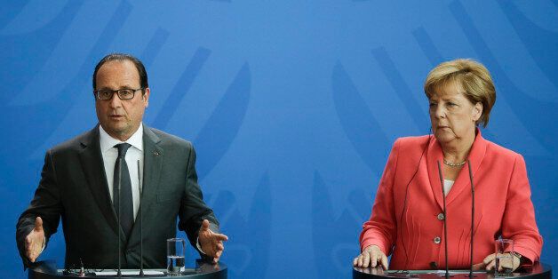 German Chancellor Angela Merkel, right, and French President Francois Hollande brief the media about the European migrant's crisis prior to a meeting at the chancellery in Berlin, Monday, Aug. 24, 2015. (AP Photo/Markus Schreiber).