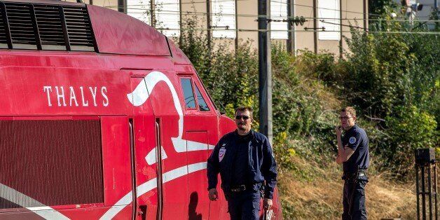 A French police officer walks along the platform next to a Thalys train of French national railway operator SNCF at the main train station in Arras, northern France, on August 22, 2015, the day after an armed gunman on the train was overpowered by passengers. The gunman opened fire on the train travelling from Amsterdam to Paris, injuring two people before being tackled by several passengers including off-duty American servicemen. . AFP PHOTO PHILIPPE HUGUEN (Photo credit should read PHILIPPE HUGUEN/AFP/Getty Images)