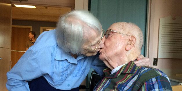 CORRECTS PHOTOGRAPHER'S NAME TO PAUL J. GESSLER FROM PAUL J. KESSLER - Walter and Leslie Kimmel, who are both 100 years old, enjoy a kiss as they celebrate their 75th wedding anniversary Tuesday, Aug. 18, 2015, at Charlestown Retirement Community in Catonsville, Md. The Kimmels met at Emmanuel Lutheran Church in Baltimore when they were 22 years old. Leslie played the organ and Walter sang in the choir. (Paul J. Gessler/WBFF-TV via AP)
