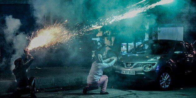 Masked kurdish millitants fire fireworks towards Turkish police during clashes during clashes on August 27,2015 in the Gazi district of Istanbul. Five people, including two children and a soldier, were killed in clashes between Kurdish militants and security forces in Turkey's restive Kurdish-majority southeast on August 27, 2015, local officials and the army said.. AFP PHOTO / OZAN KOSE (Photo credit should read OZAN KOSE/AFP/Getty Images)