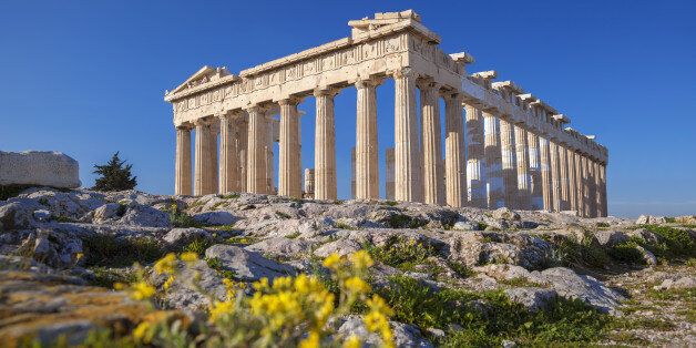 Famous Parthenon temple with spring flowers on the Acropolis in Athens, Greece