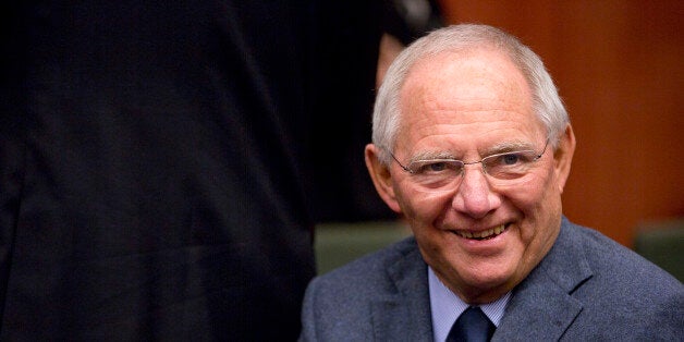 German Finance Minister Wolfgang Schaeuble waits for the start of a meeting of the eurogroup finance ministers at the EU Council building in Brussels on Monday, Dec. 8, 2014. (AP Photo/Virginia Mayo)