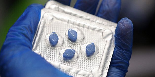 A blister pack containing Pfizer's Viagra tablets, produced by Pfizer Inc., is arranged for a photograph...