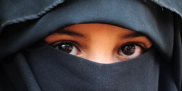 Covered Muslim child.