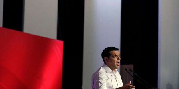 Greek Prime Minister Alexis Tsipras addresses a meeting of his ruling radical left Syriza party's central committee in Athens, on Thursday, July 30, 2015. Tsipras called for an extraordinary party congress in September, after Greece is expected to seal a new bailout deal with its international creditors, in a bid to end a rebellion by his hardline lawmakers that is threatening to topple his coalition government. (AP Photo/Thanassis Stavrakis)