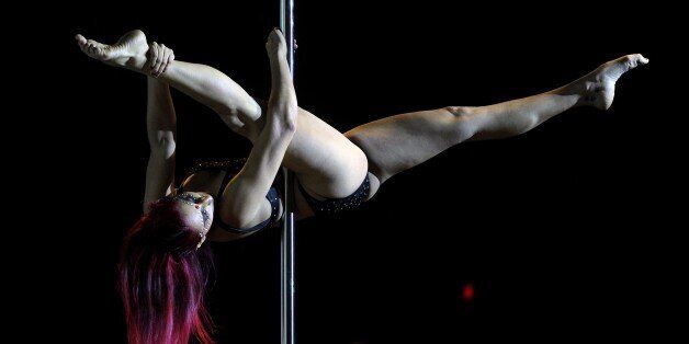 Argentine pole dancer Florencia Forquera competes in the Argentina Amatuer 2014 Pole Dance competition in Buenos Aires on November 24, 2014. AFP PHOTO / Juan Mabromata (Photo credit should read JUAN MABROMATA/AFP/Getty Images)