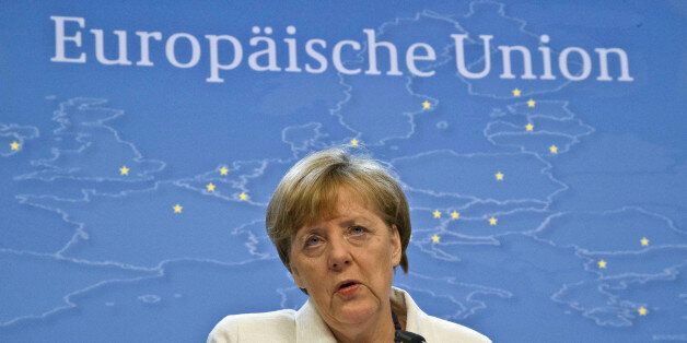 German Chancellor Angela Merkel speaks during a media conference after a meeting of eurozone heads of state at the EU Council building in Brussels on Monday, July 13, 2015. A summit of eurozone leaders reached a tentative agreement with Greece on Monday for a bailout program that includes