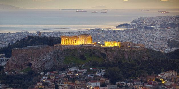 Athens, Greece. After sunset. Parthenon and Herodium construction in Acropolis Hill