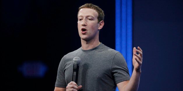 CEO Mark Zuckerberg gestures while talking about the Messenger app during the Facebook F8 Developer Conference Wednesday, March 25, 2015, in San Francisco. Facebook is trying to mold its Messenger app into a more versatile communications channel as smartphones create new ways for people to connect with friends and businesses beyond the walls of the company's ubiquitous social network. (AP Photo/Eric Risberg)