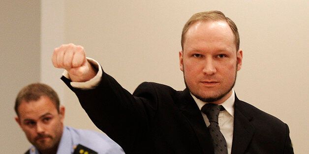 FOR USE AS DESIRED, YEAR END PHOTOS - FILE - In this Aug. 24, 2012 file photo, mass murderer Anders Behring Breivik, makes a salute after arriving in the court room at a courthouse in Oslo. Breivik, who admitted killing 77 people in Norway last year, was declared sane and sentenced to prison for bomb and gun attacks. (AP Photo/Frank Augstein, File)