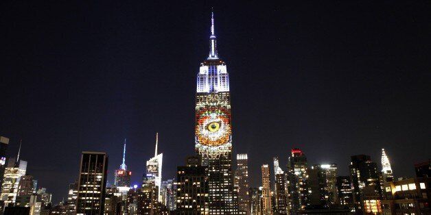 An eye is projected on the Empire State Building, in the 'Projecting Change on the Empire State Building' project, made by the Oscar winning director and founder of Oceanic Preservation Society Louis Psihoyos and producer Fisher Stevens in New York on August 1, 2015. PHOTO/ KENA BETANCUR (Photo credit should read KENA BETANCUR/AFP/Getty Images)