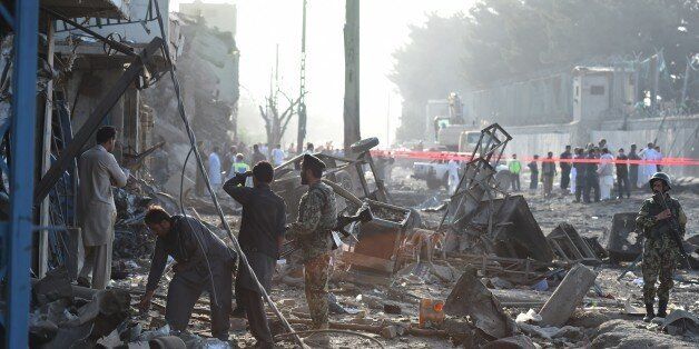 Afghan security forces inspect the site of a powerful truck bomb in Kabul on August 7, 2015. A powerful truck bomb killed at least seven people and wounded more than 100 others, officials said, the first major attack in the Afghan capital since the announcement of Taliban leader Mullah Omar's death. AFP PHOTO / Wakil Kohsar (Photo credit should read WAKIL KOHSAR/AFP/Getty Images)
