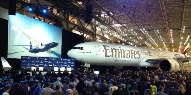 Boeing Co. employees gather to celebrate the completion of the 1,000th 777 airplane, Friday, March 2, 2012, in Everett, Wash. The plane will be delivered to Emirates Airline. (AP Photo/Ted S. Warren)