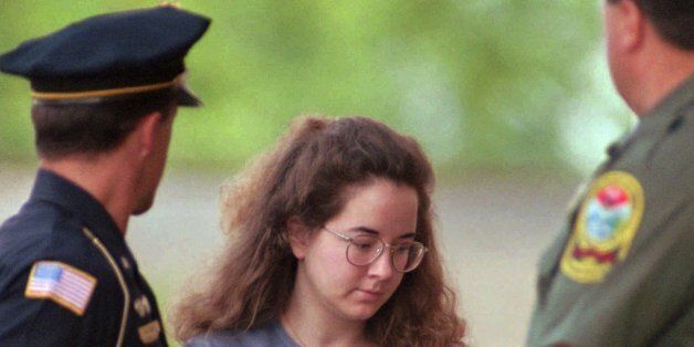 Susan Smith is escorted into the Union County Courthouse in Union, SC., on Thursday, July 27, 1995. Smith was convicted last week of murder for the drowning deaths of her two boys Alex and Michael and the prosecution is seeking the death penalty during the sentencing phase of her trial. (AP Photo/Lou Krasky)