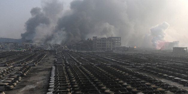 TIANJIN, CHINA - AUGUST 13: (CHINA OUT) Burnt car debris continues to smoulder following the explosion of a warehouse in Binhai New Area on August 13, 2015 in Tianjin, China. At least 17 people dead, 32 are in critical condition and at least another 400 injured during the explosions of a warehouse on late Wednesday in Binhai New Area in Tianjin, according to police authority. (Photo by ChinaFotoPress/ChinaFotoPress via Getty Images)