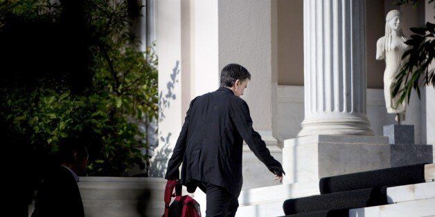 Greek finance minister Euclid Tsakalotos arrives for a cabinet meeting at the Maximos Mansion on August 5, 2105. Greek Prime Minister Alexis Tsipras on July 8 said his government is nearing a deal with international creditors on a mammoth bailout, as his spokeswoman raised the prospect of early elections in the fall. AFP PHOTO / ANGELOS TZORTZINIS (Photo credit should read ANGELOS TZORTZINIS/AFP/Getty Images)