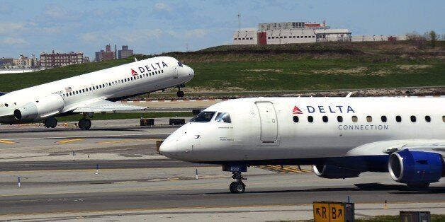 NEW YORK, NY - APRIL 28, 2015: Delta Airlines and Delta Connection passenger aircraft taxi and take off at LaGuardia Airport in New York City, New York. (Photo by Robert Alexander/Getty Images)