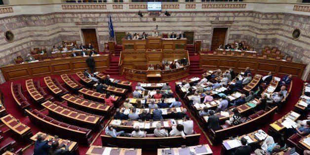 A general view shows a debate of Greek parliament commissions prior to a plenary session in Athens on August 13, 2015. Greek lawmakers will hold an emergency parliament session for a crucial vote on ratifying a hurriedly-concluded bailout deal, but Germany -- Europe's de facto paymaster -- has cast doubt on the agreement. AFP PHOTO/ LOUISA GOULIAMAKI (Photo credit should read LOUISA GOULIAMAKI/AFP/Getty Images)