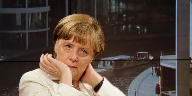German Chancellor Angela Merkel waits prior to an interview at the studios of German public broadcaster ARD in Berlin, Germany, Sunday, July 19, 2015. (AP Photo/Markus Schreiber)