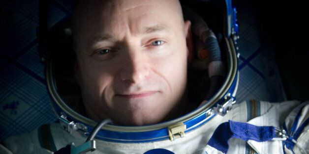 Expedition 26 Commander Scott Kelly wears a blue wrist band that has a peace symbol, a heart and the word "Gabby" to show his love of his sister-in-law U.S. Rep. Gabrielle Giffords as he rest onboard a Russian Search and Rescue helicopter shortly after he and fellow crew members Oleg Skripochka and Alexander Kaleri landed in their Soyuz TMA-01M capsule near the town of Arkalyk, Kazakhstan on Wednesday, March 16, 2011. NASA Astronaut Kelly, Russian Cosmonauts Skripochka and Kaleri are returning from almost six months onboard the International Space Station where they served as members of the Expedition 25 and 26 crews. Photo Credit: (NASA/Bill Ingalls)