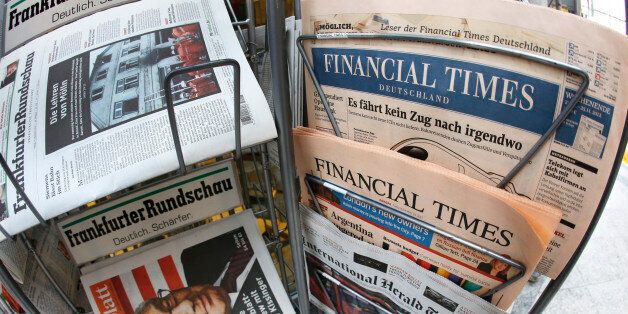 An edition of the Financial Times Deutschland is seen at a newspaper and tobacco shop in Frankfurt, Germany, Friday, Nov. 23, 2012. The publisher of the Financial Times' German offshoot says production will be stopped shortly and some 320 employees will lose their jobs. The Financial Times Deutschland, which has a circulation of about 100,000, was launched at the height of the Internet boom in 2000 but was never profitable. Hamburg-based publisher Gruner + Jahr said in a statement Friday it sees