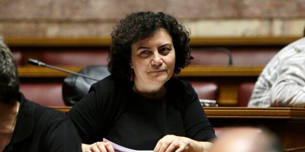 Lawmaker Nadia Valavani attends a meeting with lawmakers of Syriza governing party at the Greek Parliament in Athens, Wednesday, July 15, 2015. Greece's Alternate Finance Minister Nadia Valavani has resigned from government in protest over the austerity measures the country is asked to implement in exchange for a bailout. (AP Photo/Petros Karadjias)