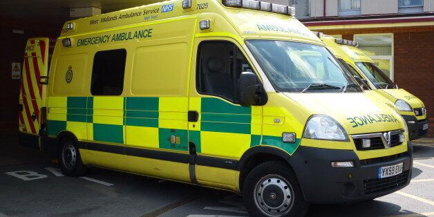 An NHS West Midlands Ambulance Service emergency ambulance, outside the Accident & Emergency department of Warwick Hospital.