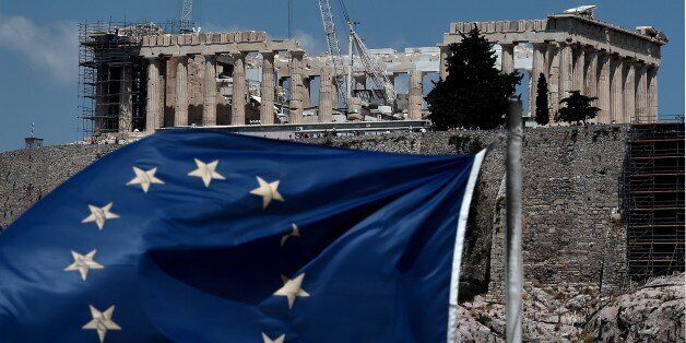 An EU flag waves in front of the ancient temple of Parthenon atop the Acropolis hill in Athens on July 7, 2015. Eurozone leaders will hold an emergency summit in Brussels on July 7 to discuss the fallout from Greek voters' defiant 'No' to further austerity measures, with the country's Prime Minister Alexis Tsipras set to unveil new proposals for talks. AFP PHOTO /ARIS MESSINIS (Photo credit should read ARIS MESSINIS/AFP/Getty Images)