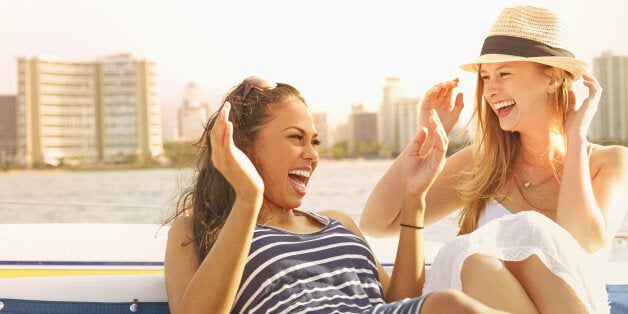 Women laughing together on boat