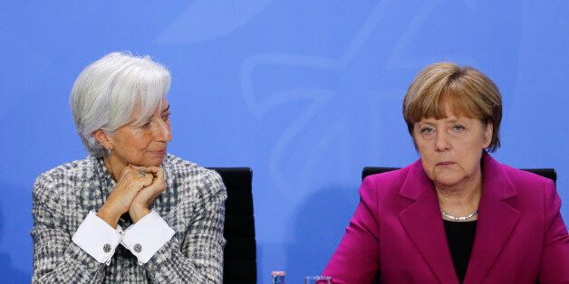 German Chancellor Angela Merkel, right, and Christine Lagarde, Managing Director of the International Monetary Fund, attend a news conference during a meeting with the heads of international finance and trade organizations, World Bank, World Trade Organization, International Monetary Fund, Organisation for Economic Cooperation and Development (OECD) and the International Labour Organization at the chancellery in Berlin, Wednesday, March 11, 2015. (AP Photo/Markus Schreiber)