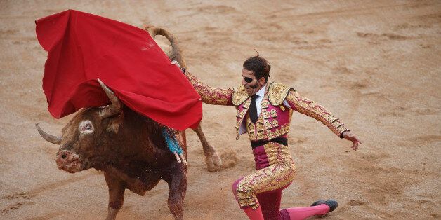 Spanish bullfighter Juan Jose Padilla performs with a Garcigrande ranch fighting bull during a bullfight of the San Fermin festival in Pamplona, Spain, Monday, July 13, 2015. Revelers from around the world arrive in Pamplona every year to take part in some of the eight days of party and the running of the bulls. (AP Photo/Daniel Ochoa de Olza)