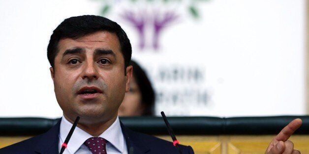 Selahattin Demirtas, co-leader of the pro-Kurdish People's Democratic Party (HDP), addresses the Turkish parliament in Ankara on July 28, 2015. NATO gave its strong backing to Turkey's fight against 'terrorism' at an emergency meeting called to discuss Ankara's strikes against Islamic State fighters and Kurdish rebels. The talks in Brussels came as President Tayyip Erdogan insisted that Turkey would press on with the dual offensive against two mutually hostile groups despite questions about his country's motives. AFP PHOTO / ADEM ALTAN (Photo credit should read ADEM ALTAN/AFP/Getty Images)