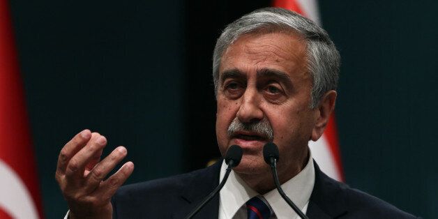 Newly elected Turkish Cypriot leader Mustafa Akinci speaks to the media after talks with Turkish President Recep Tayyip Erdogan in Ankara, Turkey, Wednesday, May 6, 2015. Akinci is in Ankara on a one-day official visit.(AP Photo/Burhan Ozbilici)