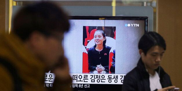 A TV news program shows Kim Yo Jong, North Korean leader Kim Jong Un's younger sister, at Seoul Railway Station in Seoul, South Korea, Thursday, Nov. 27, 2014. North Korea has revealed that Kim is a senior official in the ruling Workers' Party, strengthening analysts' views that she is an increasingly important part of the family dynasty that runs the country. The letters read