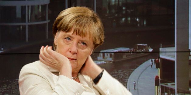 German Chancellor Angela Merkel waits prior to an interview at the studios of German public broadcaster ARD in Berlin, Germany, Sunday, July 19, 2015. (AP Photo/Markus Schreiber)