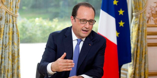 French President Francois Hollande speaks during the annual television interview on Bastille Day at the Elysee Palace in Paris, France, Tuesday, July 14, 2015. France is celebrating Bastille Day with a spectacular display of fighter jets â and with anti-terror forces marching in the yearly parade in Paris for the first time as the country's leadership tries to show its muscle against extremists abroad and at home. (Alain Jocard, Pool photo via AP)