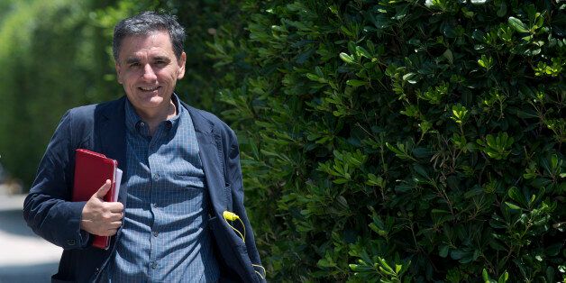 Greece's Deputy Foreign Minister for international economic relations, Euclid Tsakalotos, arrives at the Prime minister's office for an emergency meeting, in Athens, Monday, June 15, 2015. Tsipras held an meeting with the team of Greek bailout negotiators, and said the talks had stalled on demands by the creditors â the other eurozone states and the IMF â for a new round of pension cuts, which his government rejected.(AP Photo/Petros Giannakouris)