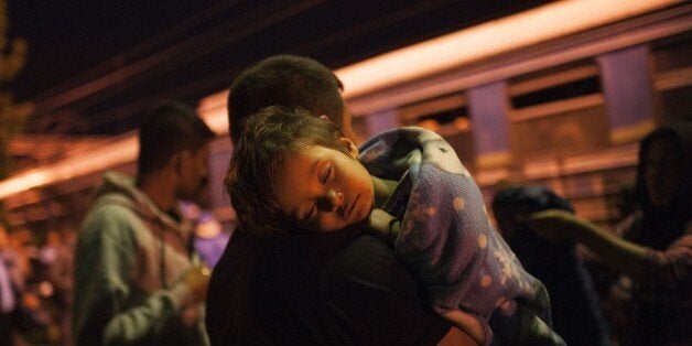 Migrants get out of a train at a railway station on the Tabanovce border crossing between Macedonia and Serbia, on June 27, 2015, on their way north to European countries. Peter Sutherland, the UN Secretary General's special representative on international migration, bemoaned on June 26th the EU leaders' failure to approve a plan to share a total of 60,000 would-be refugees, mainly from Syria and Eritrea, across the 28-nation bloc. More than 100,000 migrants have crossed the Mediterranean so far this year, most of them landing in Italy, Greece and Malta who say their EU partners should share more of the burden. AFP PHOTO / ROBERT ATANASOVSKI (Photo credit should read ROBERT ATANASOVSKI/AFP/Getty Images)