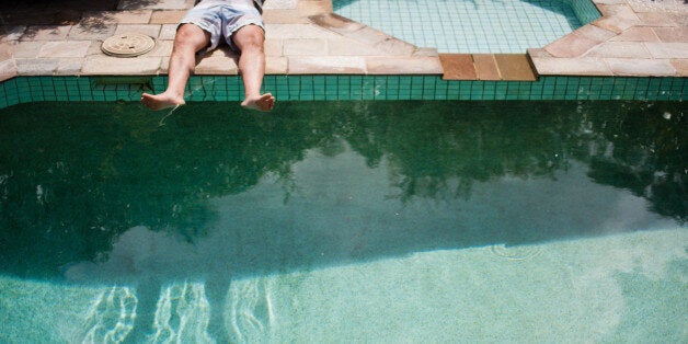 Sunbaking legs near pool