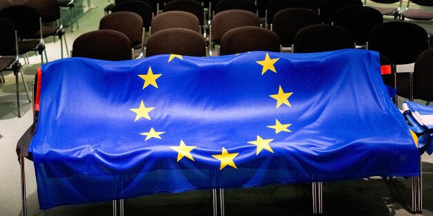 BERLIN, GERMANY - MARCH 23: The flag of the European Union lies on chairs after German Chancellor Angela Merkel and Greek Prime Minister Alexis Tsipras spoke to the media upon his arrival for talks at the Chancellery on March 23, 2015 in Berlin, Germany. The two leaders are meeting as relations between the Tsipras government and Germany have soured amidst contrary views between the two countries on how Greece can best work itself out of its current economic morass. (Photo by Carsten Koall/Gett