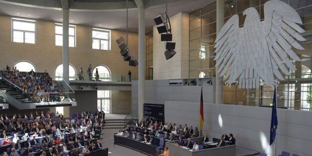 German Chancellor Angela Merkel delivers a speech during a session at the Bundestag lower house of parliament on the Greek crisis on July 1, 2015 in Berlin. AFP PHOTO / ODD ANDERSEN (Photo credit should read ODD ANDERSEN/AFP/Getty Images)