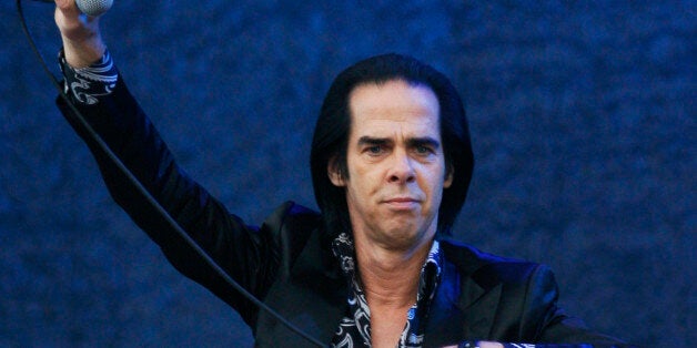 Nick Cave & The Bad Seeds performs at the Glastonbury Music Festival at Glastonbury, England on Sunday, June 30, 2013. Thousands are enjoying the three day festival that started on Friday, June 28, 2013 with headliners, Arctic Monkeys, the Rolling Stones and Mumford and Sons. (Photo by Jim Ross/Invision/AP)