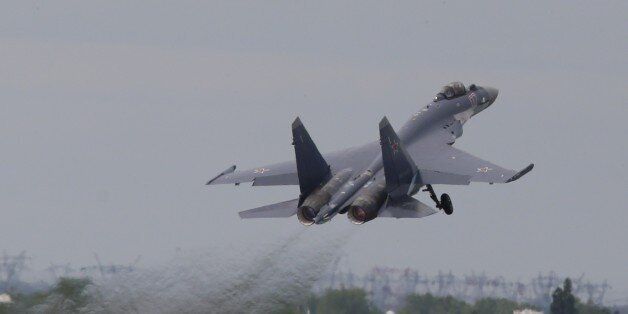 Russian air force Sukhoi su-139 fighters take off during a performance at the presentation Paris Air Show in le Bourget, North of Paris, Sunday, June 16, 2013. The Paris Air Show will open on June 17 at Le Bourget. (AP Photo/Jacques Brinon)