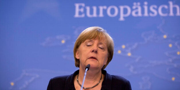 German Chancellor Angela Merkel listens to questions during a final media conference after an emergency summit of eurozone heads of state and government at the EU Council building in Brussels on Tuesday, July 7, 2015. EU leaders have called for a full EU summit to take place on Sunday, July 12, 2015 to continue discussion on the Greek crisis. (AP Photo/Virginia Mayo)